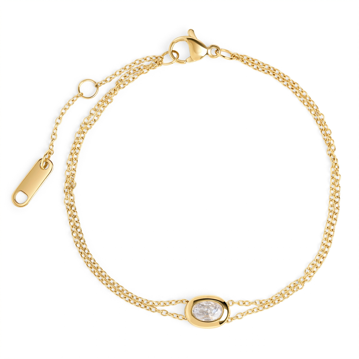 A double gold chain bracelet with an oval clear stone centerpiece, shown on a clean white background. Waterproof, stainless steel and allergy free. By Mia Bijoux Canada.
Bracelet à double chaîne dorée orné d'une pierre transparente ovale en son centre, présenté sur fond blanc épuré. Résistant à l'eau, en acier inoxydable et hypoallergénique. Par Mia Bijoux Canada.